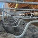 Galvanized dairy cow stalls with sand bedding